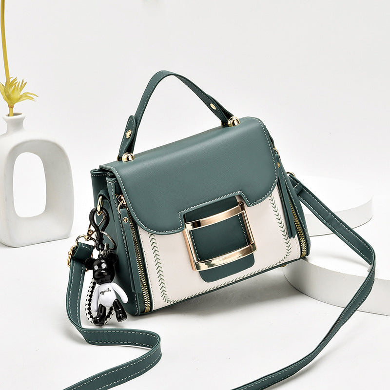High-grade women's leather bag with bear keychain accessory