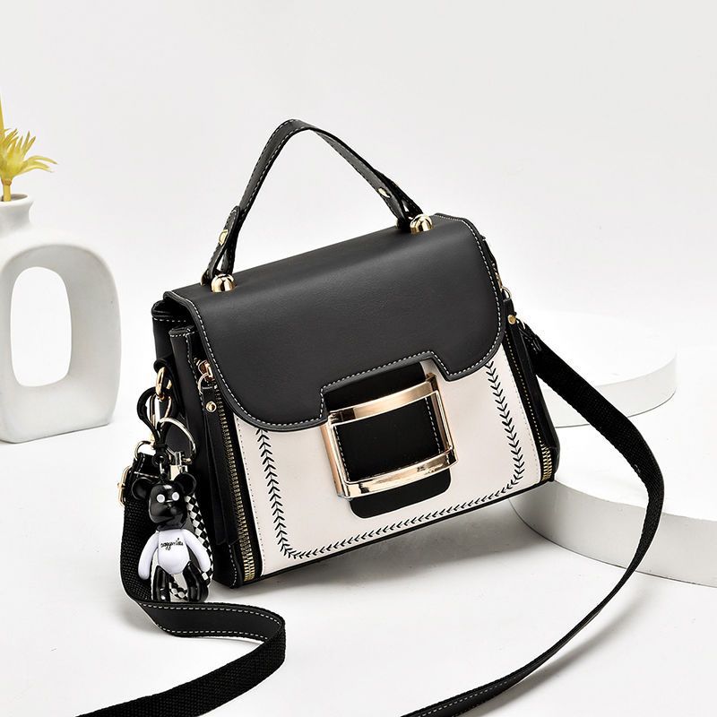 High-grade women's leather bag with bear keychain accessory