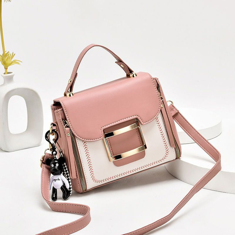 High-grade women's leather bag with bear keychain accessory